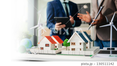 Real estate broker agent presenting and consult to customer to decision making sign insurance form agreement, home model 130511142