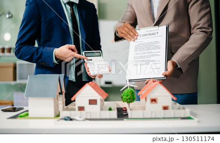 Real estate broker agent presenting and consult to customer to decision making sign insurance form agreement, home model Real estate broker agent presenting and consult to customer to decision making sign insurance form agreement, home model 130511174