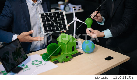 business team people planning and discussing on recycle reduce reuse policy symbol in office meeting room. Green business company business team people planning and discussing on recycle reduce reuse policy symbol in office meeting room. Green business company 130511208