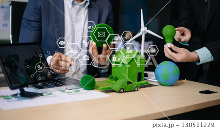 business team people planning and discussing on recycle reduce reuse policy symbol in office meeting room. Green business company business team people planning and discussing on recycle reduce reuse policy symbol in office meeting room. Green business company 130511229