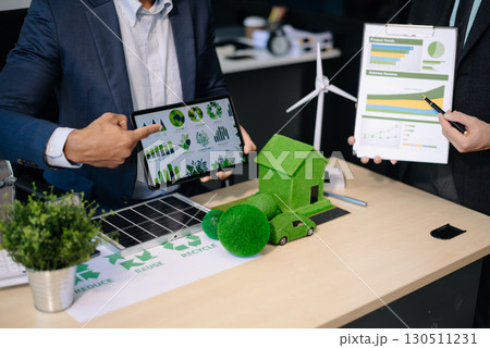 business team people planning and discussing on recycle reduce reuse policy symbol in office meeting room. Green business company business team people planning and discussing on recycle reduce reuse policy symbol in office meeting room. Green business company 130511231
