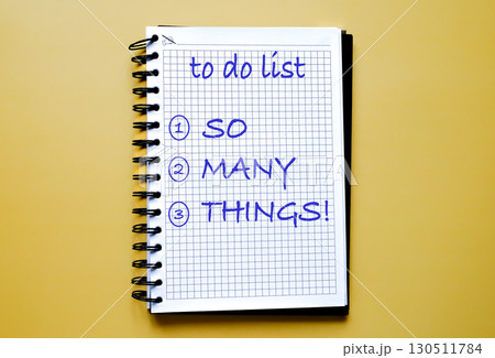 notebook with handwritten to-do list reading SO MANY things notebook with handwritten to-do list reading SO MANY things 130511784