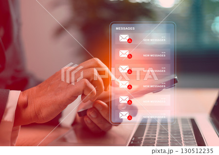 Businessman using smartphone with spam email phishing alerts on virtual screen, concept of cybersecurity threat, online fraud, scam messages, data protection, malware attack and IT security. warning 130512235