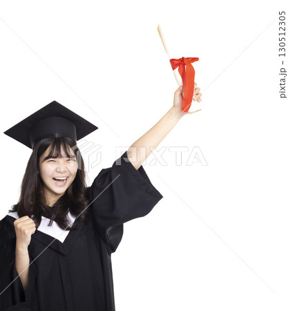 Excited Teenage girl wearing graduation gown and cap with diploma 130512305