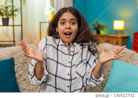 Indian woman shocked by unexpected news hands on cheeks wide eyes wow surprise reaction emotional Indian woman shocked by unexpected news hands on cheeks wide eyes wow surprise reaction emotional 130512732