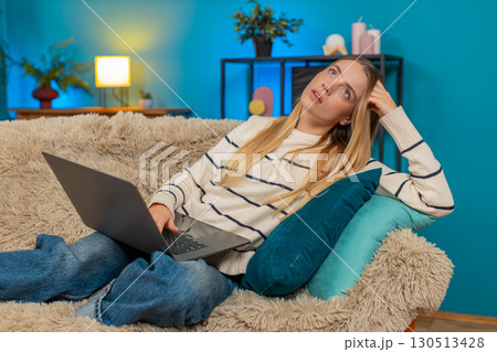Caucasian woman exhausted on sofa after work no energy using laptop indoors lying feeling tired Caucasian woman exhausted on sofa after work no energy using laptop indoors lying feeling tired 130513428