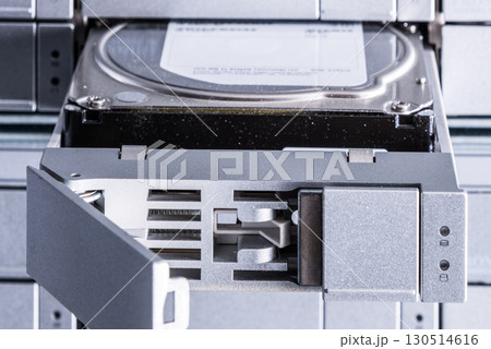 detail of hard disk in a tray that is being installed inside dat 130514616