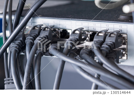 black ethernet cables connected to switch 130514644