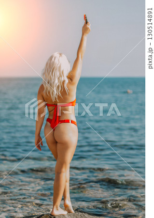 Woman Red Bikini Beach Summer: Oceanside joy, sunny day, carefree pose. Woman Red Bikini Beach Summer: Oceanside joy, sunny day, carefree pose. 130514891
