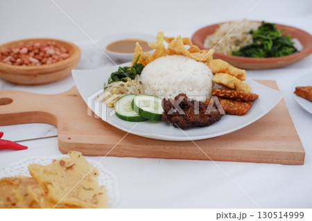 Fried Tempeh, Tofu, Egg, and Meat on Plate 130514999