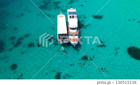 Aerial view of two recreational vessels over turquoise clear water at Racha Island, Phuket, Thailand 130515116