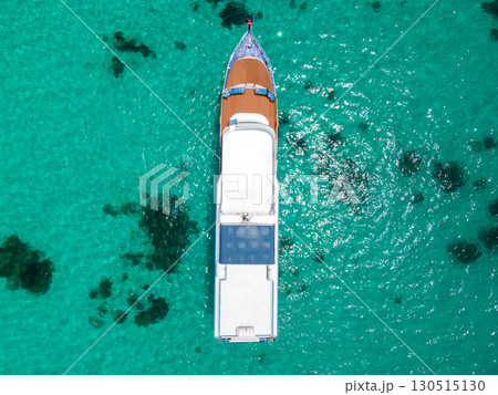 Aerial view of scuba diving boat over turquoise clear water at Racha Island in Phuket, Thailand. 130515130