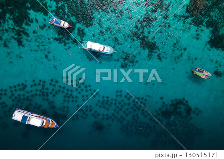 Aerial view of tour boats anchoring over the artificial reef at Racha Yai Island, Phuket, Thailand 130515171