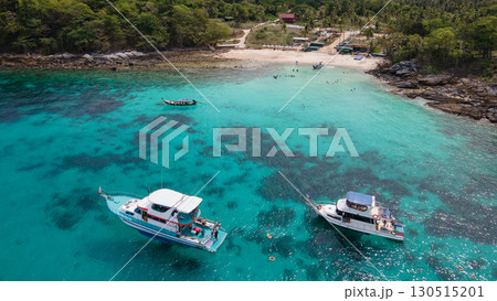 Aerial view of Koh Racha Yai Island with tourboat and longtail boat anchoring in front of the bay 130515201