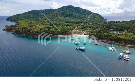 Aerial view of Koh Racha Yai Island with many tour boats around the bay in Phuket, Thailand. 130515202