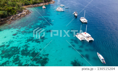 Aerial view of Koh Racha Yai Island with many tour boats around the bay in Phuket, Thailand. Aerial view of Koh Racha Yai Island with many tour boats around the bay in Phuket, Thailand. 130515204