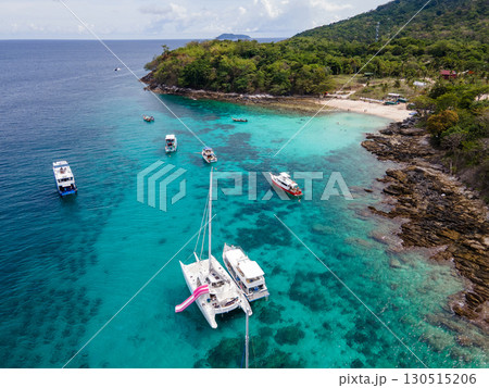 Aerial view of Koh Racha Yai Island with many tour boats around the bay in Phuket, Thailand. Aerial view of Koh Racha Yai Island with many tour boats around the bay in Phuket, Thailand. 130515206