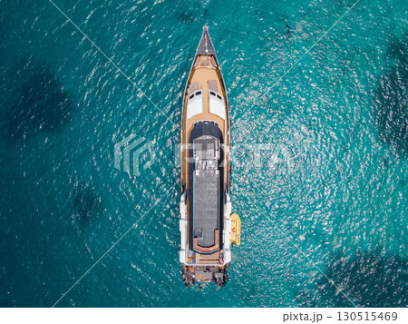 Aerial view of scuba diving boat over turquoise clear water Aerial view of scuba diving boat over turquoise clear water 130515469