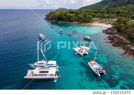 Aerial view of Koh Racha Yai Island with many tour boats around the bay, Phuket, Thailand. Aerial view of Koh Racha Yai Island with many tour boats around the bay, Phuket, Thailand. 130515475