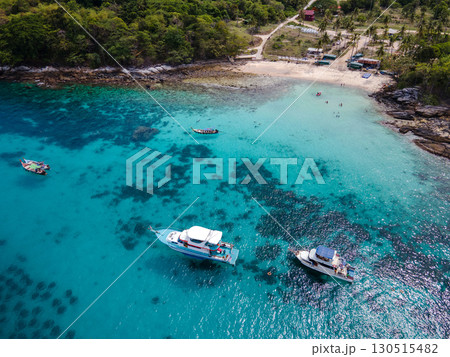 Aerial view of Koh Racha Yai Island with tourboat and longtail boat anchoring in front of the bay 130515482