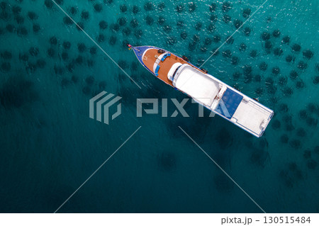 Aerial view of diving boat anchoring over the artificial reef at Racha Yai Island, Phuket, Thailand. 130515484