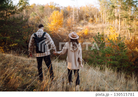 Stylish couple walking and enjoying autumn weather. People, lifestyle, vacations concept. Autumn. 130515781