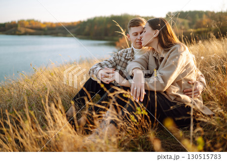 Stylish couple walking autumn weather. People, lifestyle, relaxation concept. Autumn Fashion concept Stylish couple walking autumn weather. People, lifestyle, relaxation concept. Autumn Fashion concept 130515783