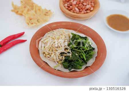 Traditional Asian Food with Vegetables and Peanut Dressing Traditional Asian Food with Vegetables and Peanut Dressing 130516326