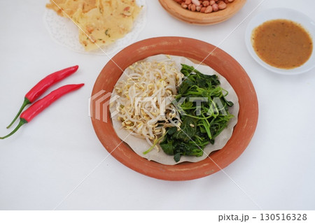 Traditional Asian Food with Vegetables and Peanut Dressing 130516328