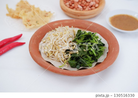 Traditional Asian Food with Vegetables and Peanut Dressing Traditional Asian Food with Vegetables and Peanut Dressing 130516330