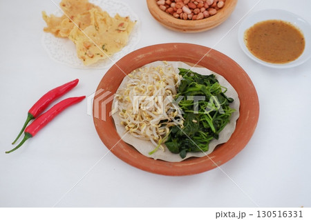 Traditional Asian Food with Vegetables and Peanut Dressing 130516331