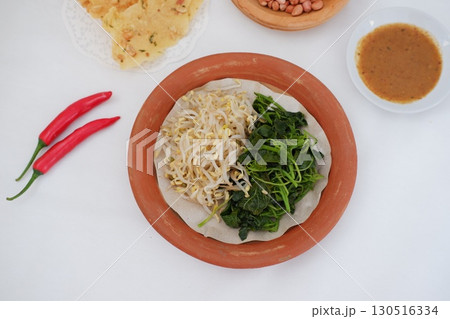 Traditional Asian Food with Vegetables and Peanut Dressing Traditional Asian Food with Vegetables and Peanut Dressing 130516334