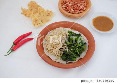 Traditional Asian Food with Vegetables and Peanut Dressing Traditional Asian Food with Vegetables and Peanut Dressing 130516335