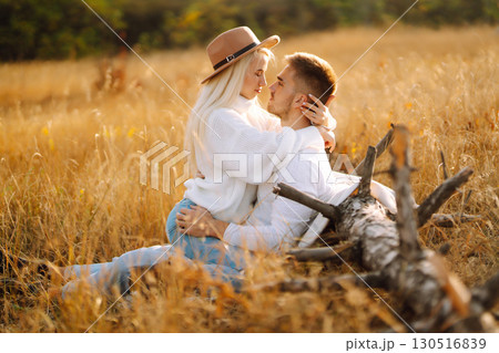 Young couple having fun walking and hugging n the park. Autumn weather. Relaxation, youth. 130516839