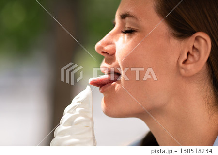 Icecream Woman Tongue Summer: Female enjoying icecream outdoors on summer day for refreshment. Icecream Woman Tongue Summer: Female enjoying icecream outdoors on summer day for refreshment. 130518234