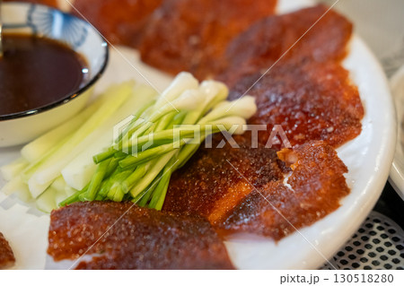 Deep fried Peking duck skin, served on plate Deep fried Peking duck skin, served on plate 130518280