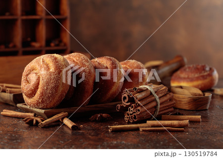 Swedish cinnamon rolls on a brown background. Swedish cinnamon rolls on a brown background. 130519784