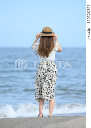 woman on the beach woman on the beach 130520568
