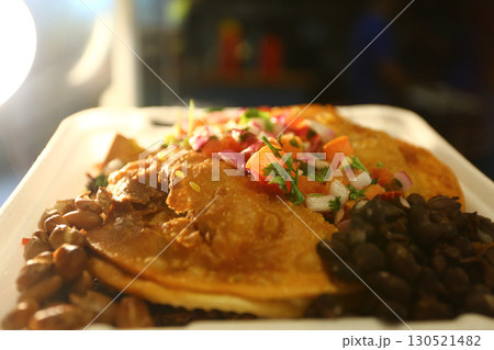 mexican food with tacos guacamole and nachos 130521482