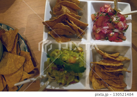 mexican food with tacos guacamole and nachos 130521484