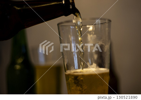 Pouring Cold Beer Into Glass Pouring Cold Beer Into Glass 130521890