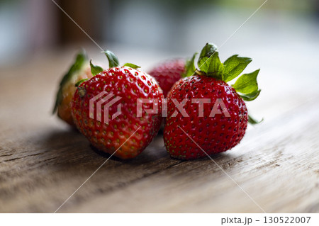 Fresh Strawberry Resting On Wooden Table 130522007
