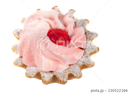 Beautiful sweets. Cakes basket with pink cream decorated with red berries on a white plate. Beautiful sweets. Cakes basket with pink cream decorated with red berries on a white plate. 130522166