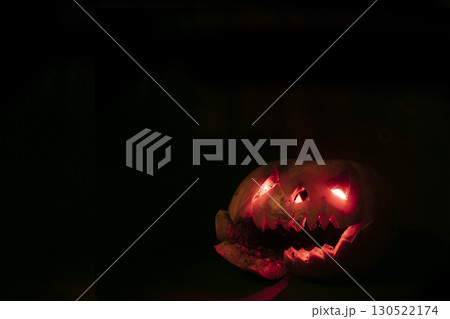 Glowing halloween pumpkin on a black background. 130522174