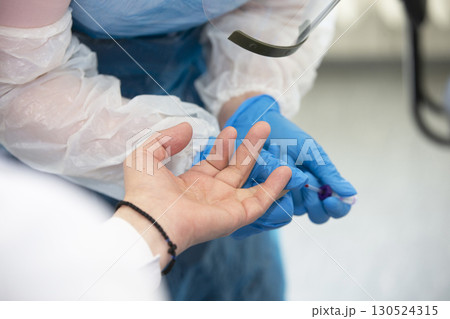 Take a blood test from a finger in a medical laboratory close-up. 130524315