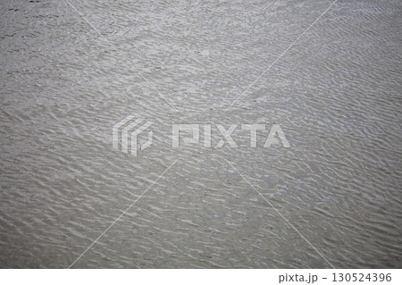 Gray water texture. Water in a river or lake. 130524396
