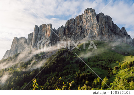 Bolshoy Tkhach mount with fog and evening sunlight. Scenic Caucasus Mountains. 130525102