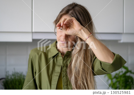 Severe headache vertigo. Suffering woman cover face in distress dizziness and physical collapse 130525981