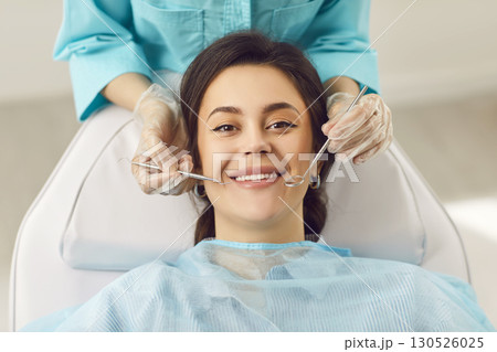 Dentist exam, teeth, gums, dental care exam, happy smiling woman healthy smile at doctor visit Dentist exam, teeth, gums, dental care exam, happy smiling woman healthy smile at doctor visit 130526025