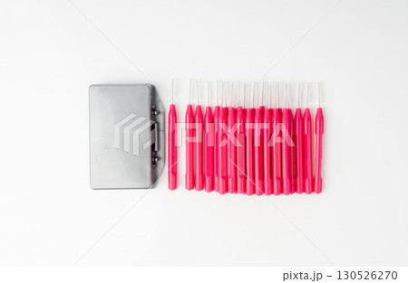 Orthodontic wax box and interdental brushes top view. Dental hygiene set Orthodontic wax box and interdental brushes top view. Dental hygiene set 130526270